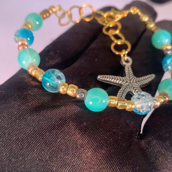 COASTAL ORBIT — Handmade Gold and Aquamarine Starfish Charm Glass Bead Bracelet - Picture 3 of 5